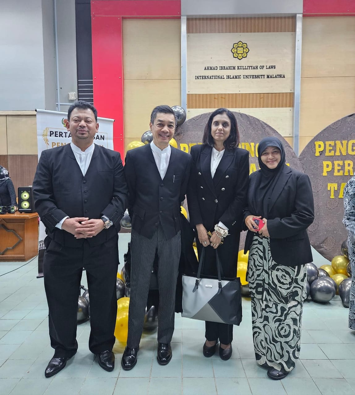 With colleagues in court dress at the Ahmad Ibrahim Kulliyyah of Laws, International Islamic University Malaysia.